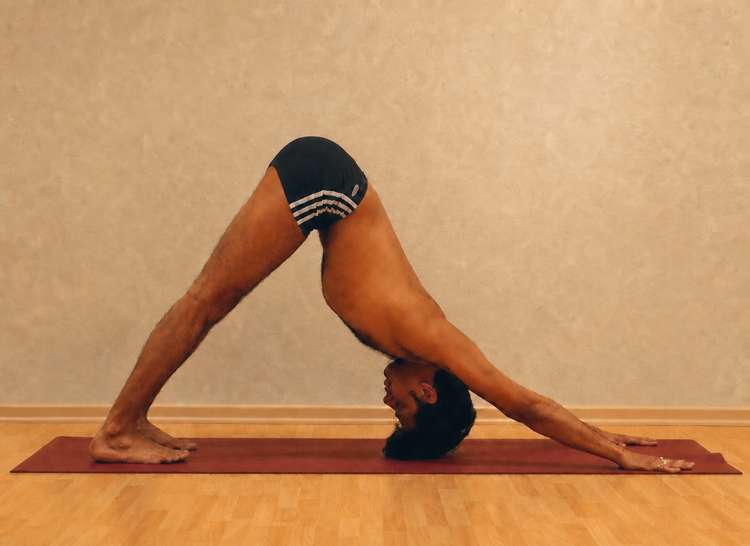 Adho Mukha Svanasana yoga practice demonstrated by Pankaj Sharma
